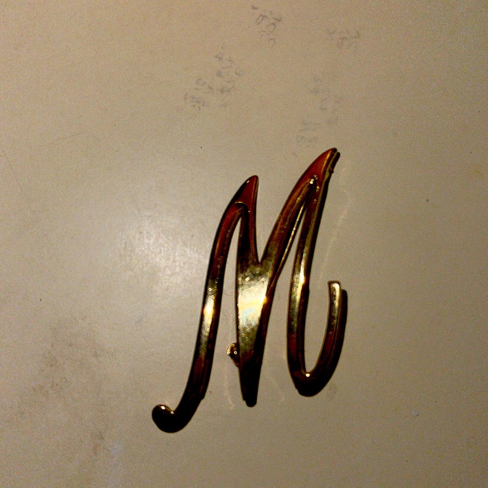 Vintage gold-tone Letter “M”or upside down to use as “W”.